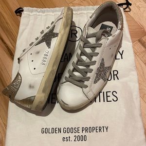 Golden Goose sneaker with silver glitter star. Size 6